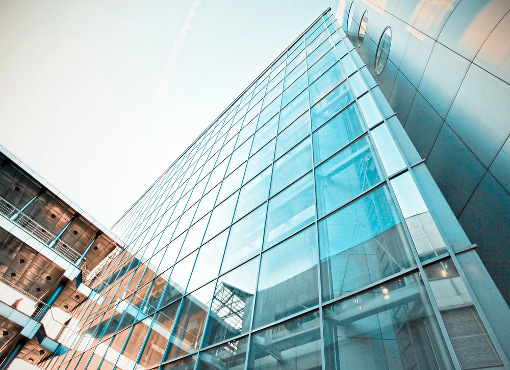 Modern glass building against clear sky